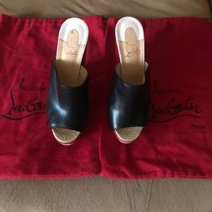 Black and red Christian Louboutins.